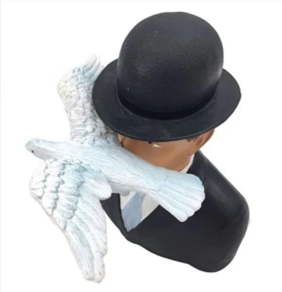 Man in a Bowler Hat with Dove by Magritte Statue - Image 2
